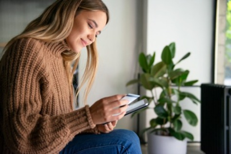 Female on Ipad with Card